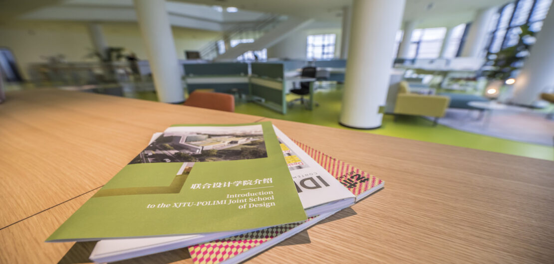 Joint School bulding, interiors, table with magazines